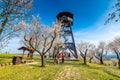 Hustopece, Czech Republic - 23.4.2021: Peoples are visiting the lookout tower and almond orchard near Hustopece city. Almond trees