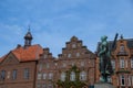 Husum, Germany 14 May 2023, The Asmussen-Woldsen monument in front of the facade of historical buildings Royalty Free Stock Photo