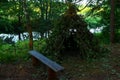 Hut from the branches of the tree for the night in the forest during a journey through the wild nature Royalty Free Stock Photo