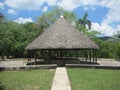 Hut with corn maize grinding wheel