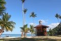 Hut or Cottage on the coconut beach. The clock tower or lifeguard tower against the blue sky Royalty Free Stock Photo