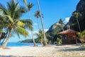 Hut or Cottage on the coconut beach. The clock tower or lifeguard tower against the blue sky Royalty Free Stock Photo