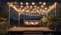 hut and deck at garden in dark sky with string lights and soft illumination Royalty Free Stock Photo