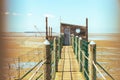 Hut of fisherman and jetty in the bay