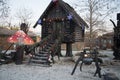 A hut made of dark wood. The hut of a character in Russian fairy tales. Baba Yaga`s House. The hut stands on chicken legs