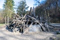 Hut made of tree trunks on stone age playground of Neanderthal Museum, Mettmann, Germany.