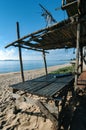 Hut over beautiful beach and tropical sea under bright sunny day Royalty Free Stock Photo