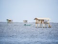 a hut on the sea, it build for protection of the farming seashell and oyster from the theif