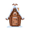 Fairy tale hut made of logs with a snow-covered roof, a stone chimney and a horseshoe for good luck Royalty Free Stock Photo