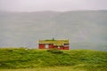 Hut wooden mountain huts in mountain pass Norway. Norwegian landscape with typical scandinavian grass roof houses. Mountain Royalty Free Stock Photo