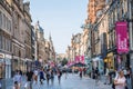 Hutcheson street view with cafes, restaurants and people replacing in outside cafes.