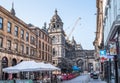 Hutcheson street view with cafes, restaurants and people replacing in outside cafes.