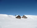 Huts in deep snow on the Alps with copy-space Royalty Free Stock Photo