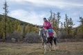 Mongolian horsemen with his horse in a snature