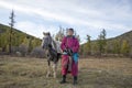 Mongolian horsemen with his horse in a snature