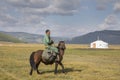 Huvsgul, Mongolia, September 6th, 2017: mongolian man riding a h