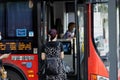 Huzhou, China June 22, 2021: Passenger waiting public transport at bus stop during Coronavirus covid-19 pandemic Royalty Free Stock Photo