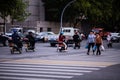 Huzhou, China 2020 September 28: Electric scooters and Car rush hours city street. Cars on road in traffic jam on