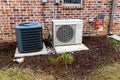 HVAC Air Conditioner Compressor and a Mini-split system together next to each other Royalty Free Stock Photo