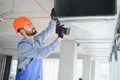 hvac engineer install heat recovery ventilation system for new house. copy space Royalty Free Stock Photo