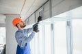 hvac engineer install heat recovery ventilation system for new house. copy space Royalty Free Stock Photo