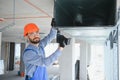 hvac engineer install heat recovery ventilation system for new house. copy space Royalty Free Stock Photo