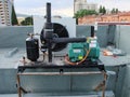 HVAC equipment installation on a restaurant rooftop, featuring a compressor and air conditioner. Royalty Free Stock Photo