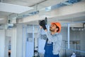 hvac indian worker install ducted pipe system for ventilation and air conditioning. copy space Royalty Free Stock Photo