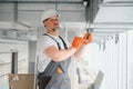 hvac services - worker install ducted pipe system for ventilation and air conditioning in office. Royalty Free Stock Photo