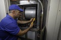 Hvac Technician Checking Current on a Motor Wire Royalty Free Stock Photo