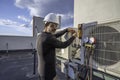 HVAC technician working on a mini-split AC Royalty Free Stock Photo