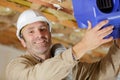 hvac technician ready to install ventilation system in house Royalty Free Stock Photo