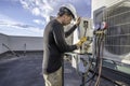 HVAC technician working on mini split Royalty Free Stock Photo