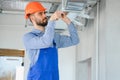 hvac worker install ducted pipe system for ventilation and air conditioning. copy space Royalty Free Stock Photo