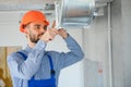 hvac worker install ducted pipe system for ventilation and air conditioning. copy space Royalty Free Stock Photo