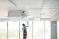 hvac worker install ducted pipe system for ventilation and air conditioning. copy space Royalty Free Stock Photo