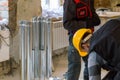 HVAC worker standing near to the metallic ductworks Royalty Free Stock Photo