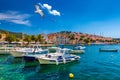 Hvar town with seagull's flying over city, famous luxury travel destination in Croatia. Boats on Hvar island, one of the many Royalty Free Stock Photo