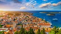 Hvar town with seagull's flying over city, famous luxury travel destination in Croatia. Boats on Hvar island, one of the many Royalty Free Stock Photo