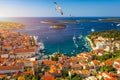 Hvar town with seagull`s flying over city, famous luxury travel destination in Croatia. Boats on Hvar island, one of the many Royalty Free Stock Photo