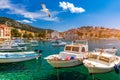 Hvar town with seagull`s flying over city, famous luxury travel destination in Croatia. Boats on Hvar island, one of the many Royalty Free Stock Photo