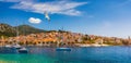 Hvar town with seagull`s flying over city, famous luxury travel destination in Croatia. Boats on Hvar island, one of the many Royalty Free Stock Photo