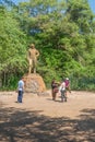 Skulpture of David Livingstone with tourist around at the Victoria Falls National Park