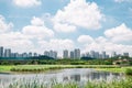 Hwarang Recreation Area park and modern apartment buildings at summer in Ansan, Korea