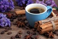 Hyacinth flowers, cup of coffee and spices on a wooden table