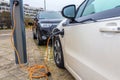 Hybrid electric cars charging with electric plug in power station