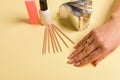 Hybrid manicure removal kit. The procedure for removing varnish from nails in progress