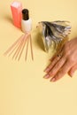 Hybrid manicure removal kit. The procedure for removing varnish from nails in progress Royalty Free Stock Photo