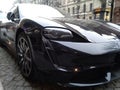 Hybrid Porsche Panamera 4 in a black color on the background of the city