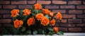 Hybrid tea roses in bouquet against brick wall, flower arranging art